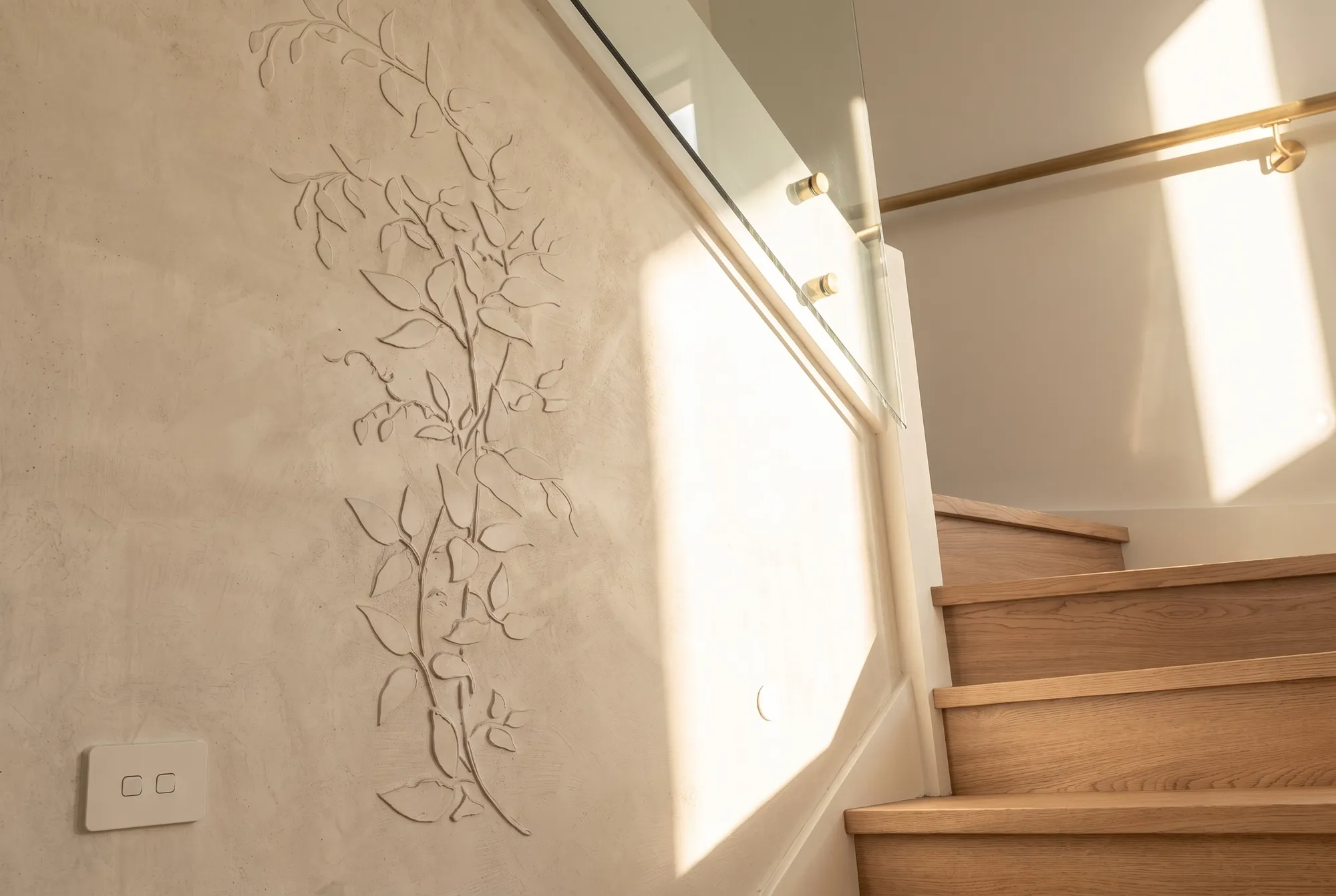 Guildford West feature staircase with textured plaster wall, real estate photography